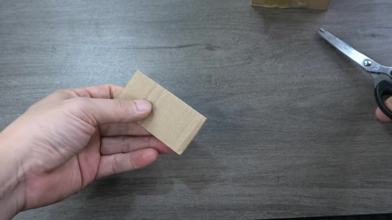 Preparing a simple cardboard mold with peanuts