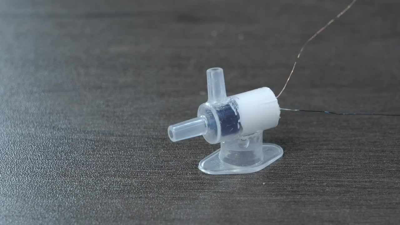 Connecting the water tube and motor wires to the battery